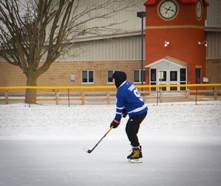 Person skating on outdoor rink in Acton